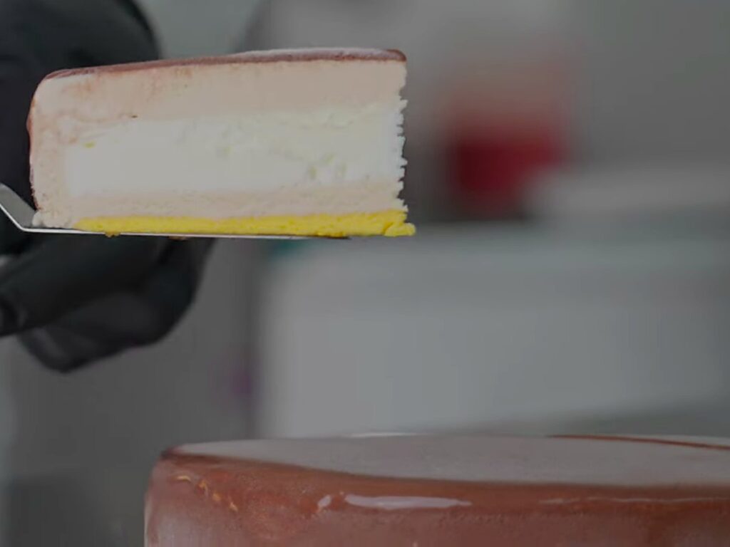 Slice of gelato cake lifted on a cake server