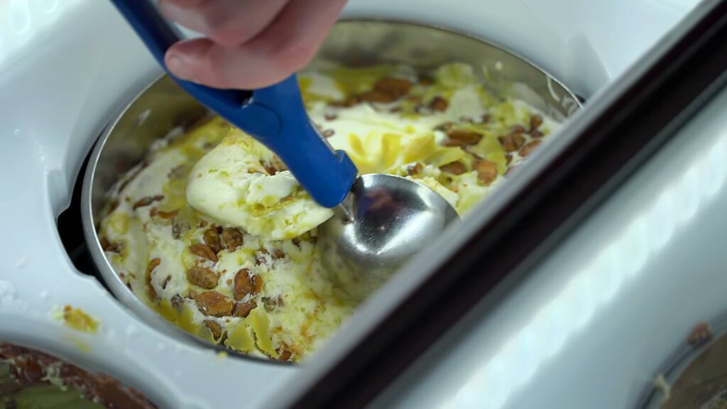 Gelato Messina and Carpigiani: How Nick Palumbo Scaled Gelato, Australian Style 15 Fior di latte gelato with pistachio praline being scooped
