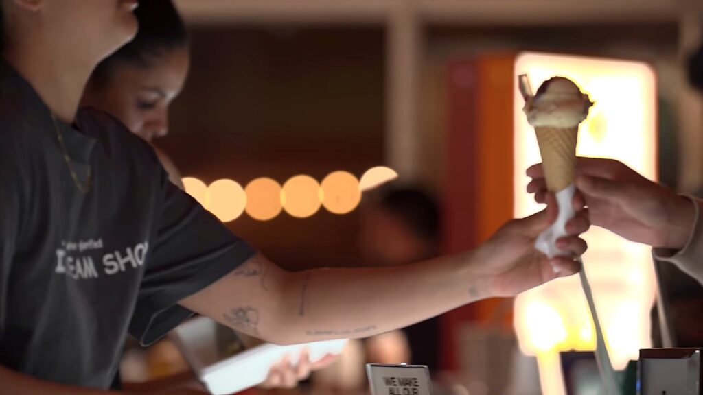 Gelato Messina and Carpigiani: How Nick Palumbo Scaled Gelato, Australian Style 22 Gelato cone handed across the counter at night