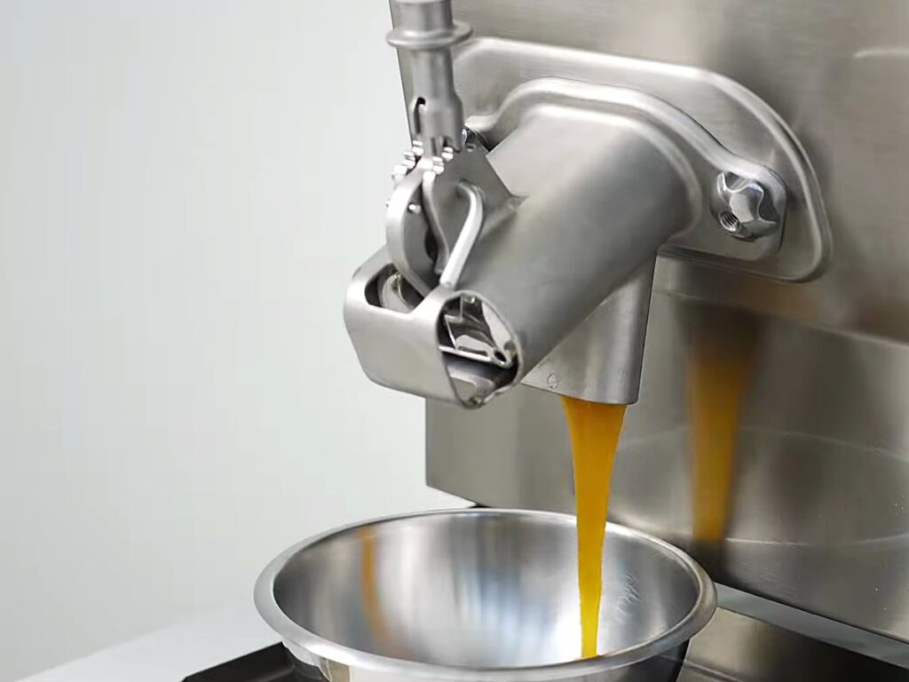 Carpigiani Lab-O-Chef 5: Pastry, Chocolate, Savoury and Gelato from One Countertop Machine 20 Amber caramel flowing from the tap into a bowl