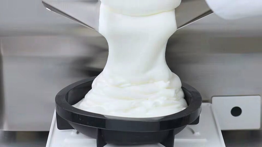 Carpigiani ReadyChef: Gelato, Pastry and Chocolate from One Batch Freezer 10 White gelato extruding into a container