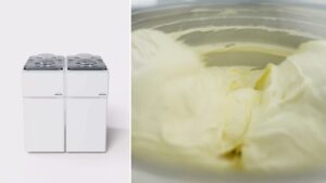 Twin Carpigiani Synthesis units beside a cylinder of freshly made gelato