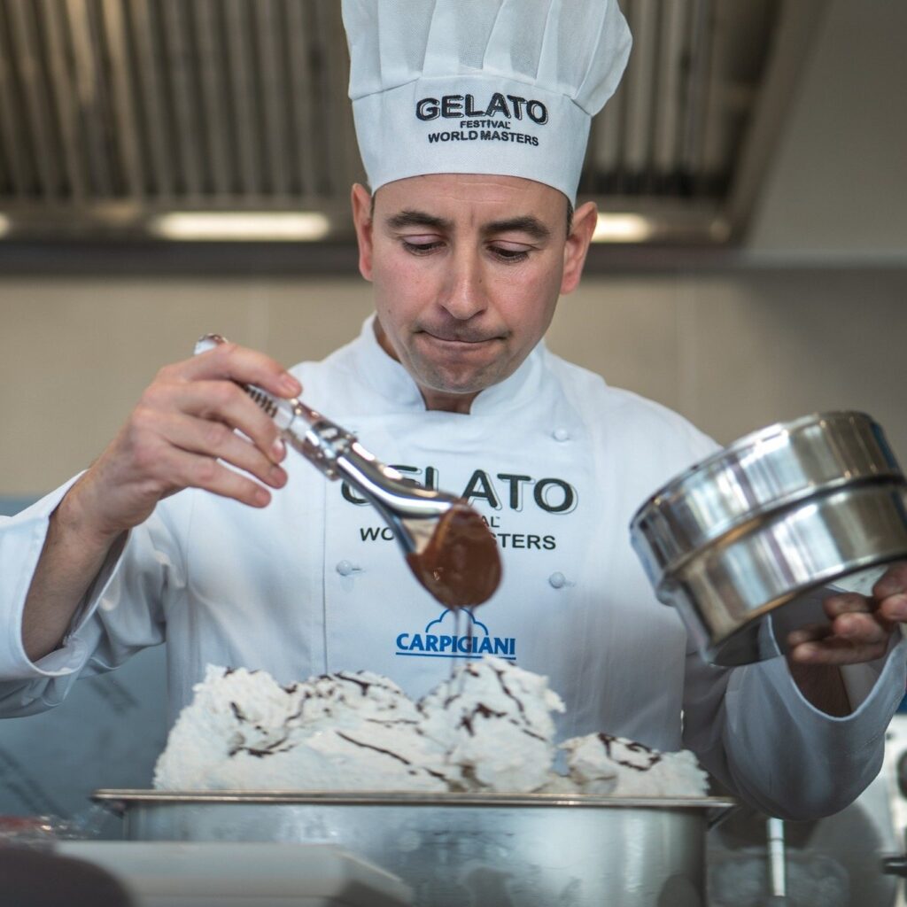 Gelato Festival World Masters Opens in São Paulo, Brazil 1 Gelato maker decorating a tub of gelato in a laboratory