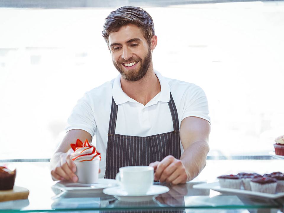 Gel Matic 17 Cafe owner serving a soft serve dessert with coffee