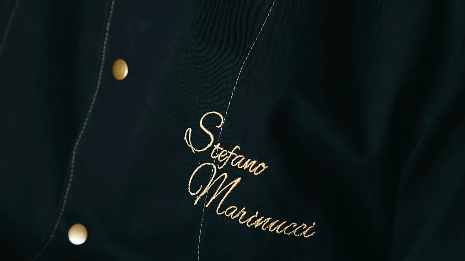 The chef’s jacket, embroidered with his name.